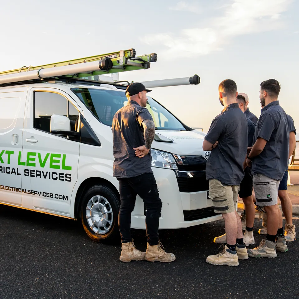 The Next Level Electrical team on site with the branded van